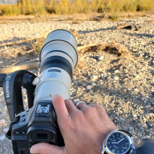 image of photographer Derek Nielsen wearing a Panerai watch doing photography in the grand Teton national park
