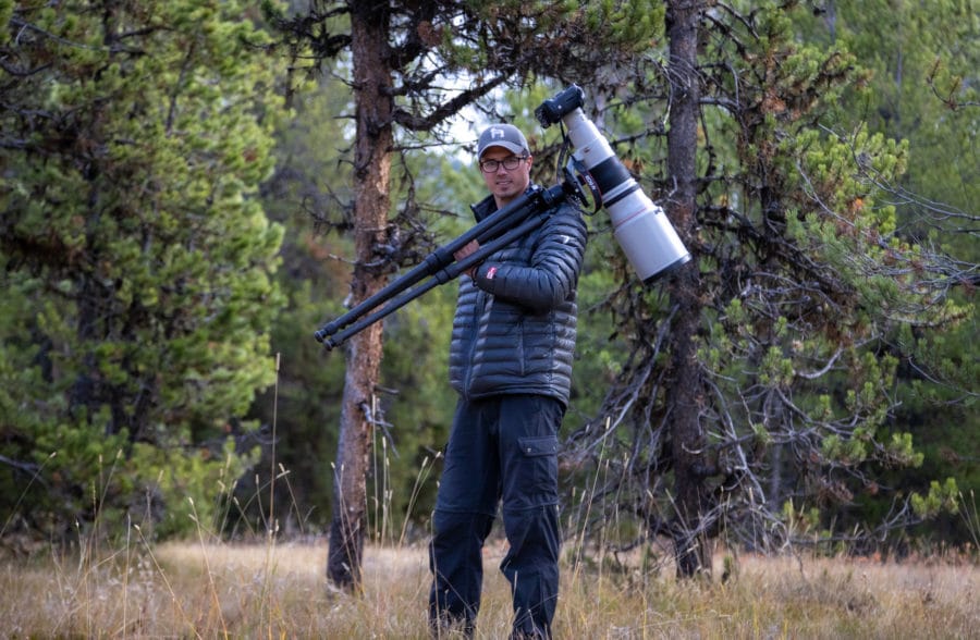 Photograph of photographer with large wildlife lens