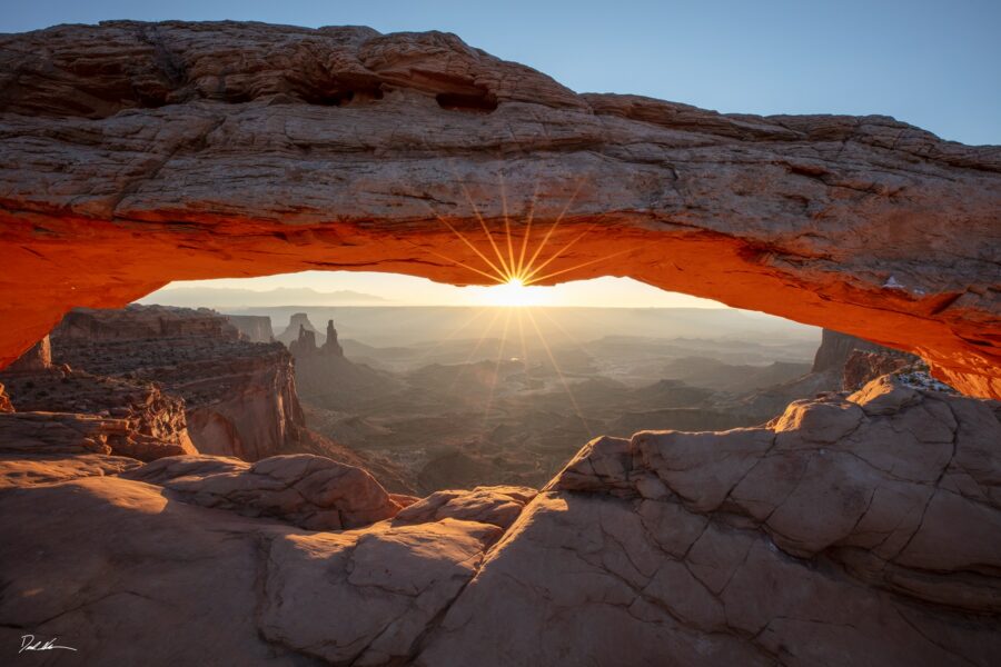 photo of sunrise through mesa arch in Canyonlands National Park