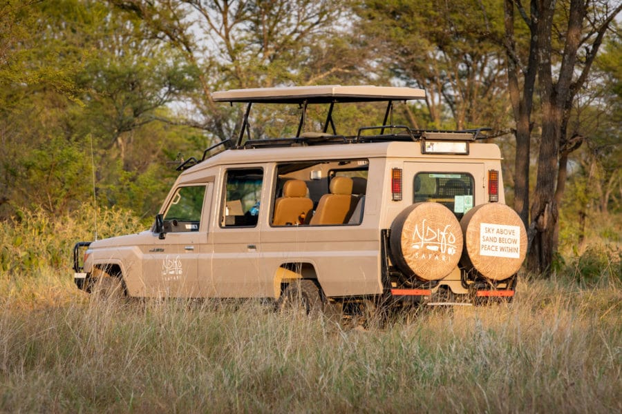 photo of a safari vehicle with top open and Ndifo wheel covers