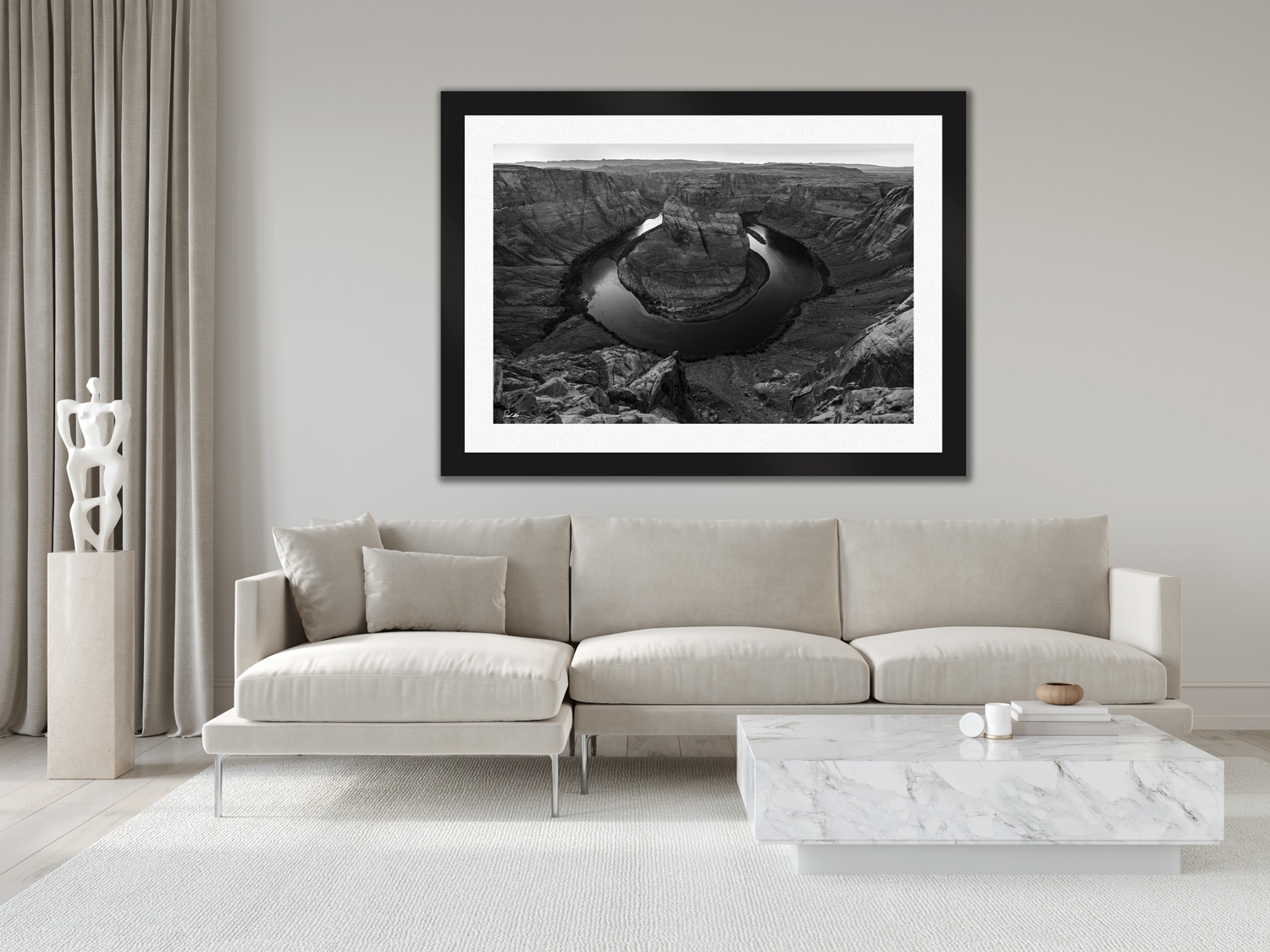 Large framed image by Derek Nielsen in black and white displayed above a couch in modern luxury home