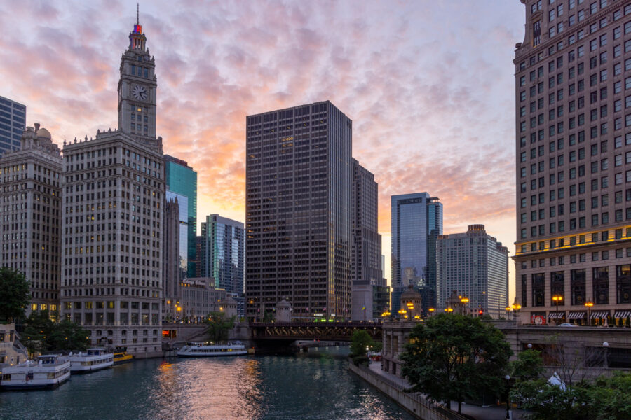 Chicago's river walk looking to the east at the Tribune tower at sunrise on the Chicago river