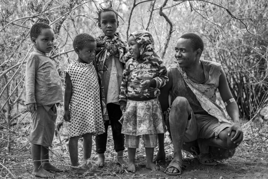 Hadzabe African tribal chief with his children