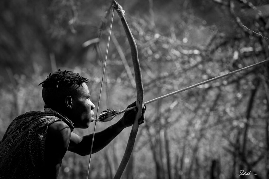 Image of a Hadzabe tribal member hunting 