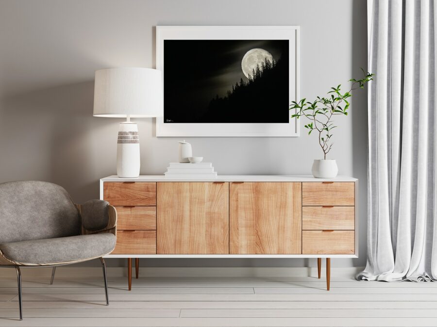 yellowstone rising moon in black and white framed and displayed in a modern home