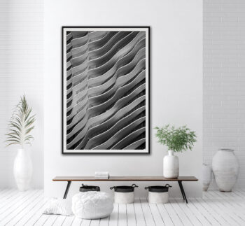 Framed abstract fine art black and white print of the Aqua building in Chicago displayed in the entry of clean modern home