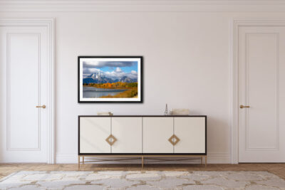 fine art print of the Teton mountains framed and displayed in a living room