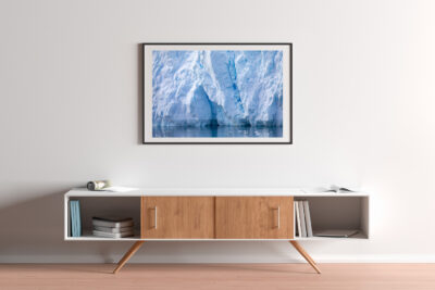 framed fine art print of a huge wall of ice in Antarctica displayed in a luxury home