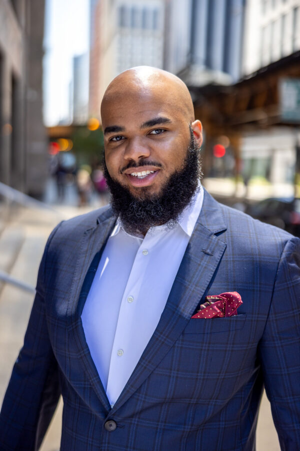 handsome business man posing during a personal brand photoshoot in Chicago