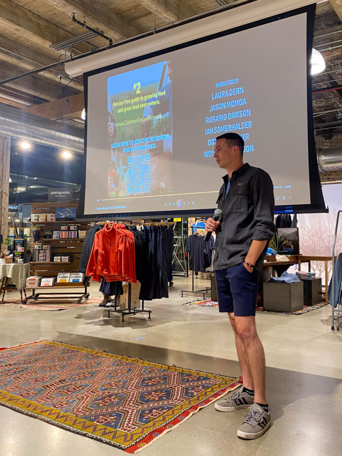 image of professional photographer Derek Nielsen giving a speech at a Patagonia store in Chicago