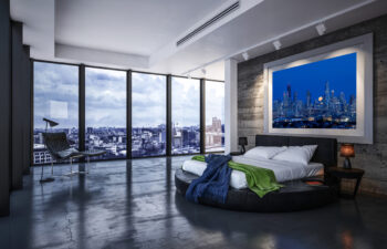 very lare framed fine art print of Chicago displayed in the bedroom of a luxury condo