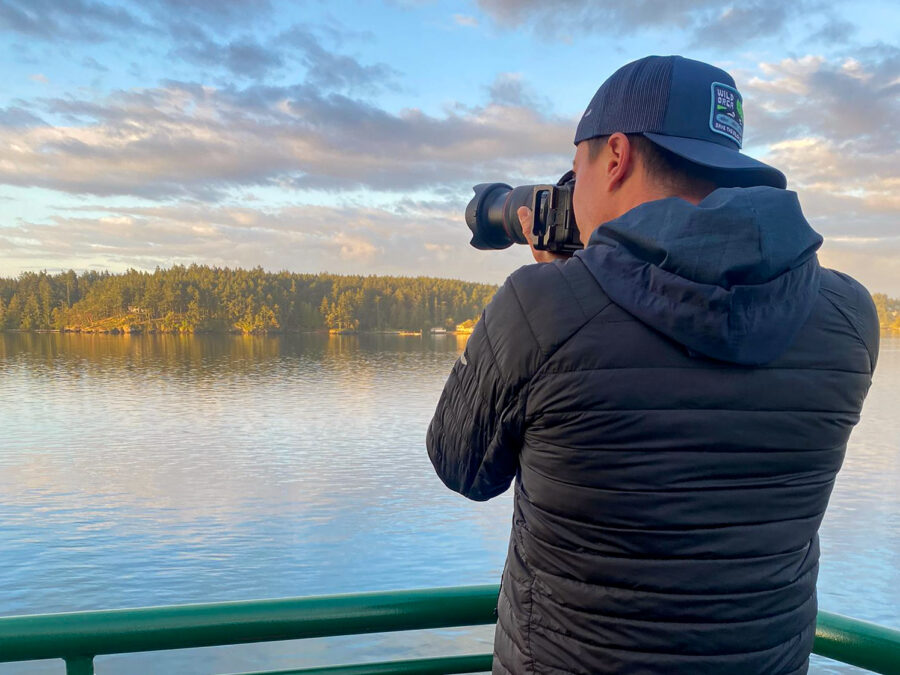 photographer Derek Nielsen taking photos in the San Juan Islands