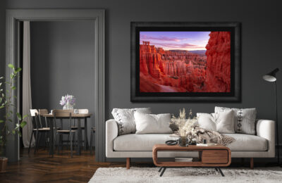 Large fine art print of Bryce Canyon framed and displayed in the living room of a modern home