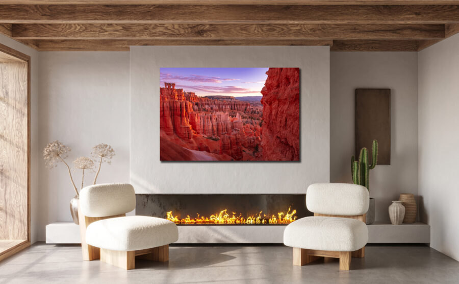 Large unframed fine art print of Bryce Canyon at sunset displayed in the living room of a modern luxury home