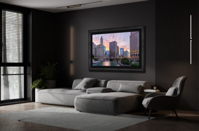 Large fine art print of Chicago's riverfront at sunrise displayed in the living room of a luxury condo