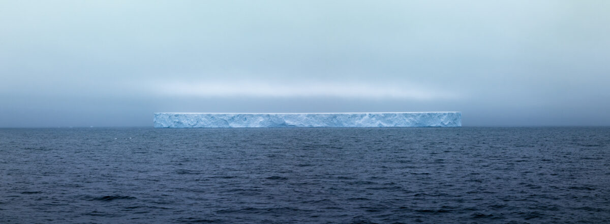 photograph of one of the largest tabular ice sheets to break off from Antarctica floating out in the Drake Passage