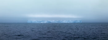 photograph of one of the largest tabular ice sheets to break off from Antarctica floating out in the Drake Passage