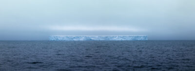 photograph of one of the largest tabular ice sheets to break off from Antarctica floating out in the Drake Passage