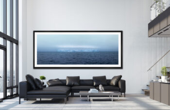 Large framed one of one fine art print of a tabular ice formation floating out in the Drake Passage displayed in a luxury penthouse condo.