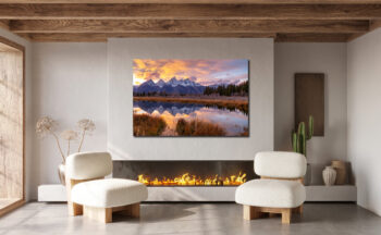 Large unframed fine art print of the Grand Tetons at sunset displayed in the living room of a Southwest home.