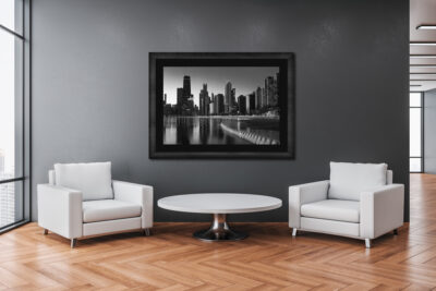 Large framed fine art black and white print of Chicago in winter displayed in a office building