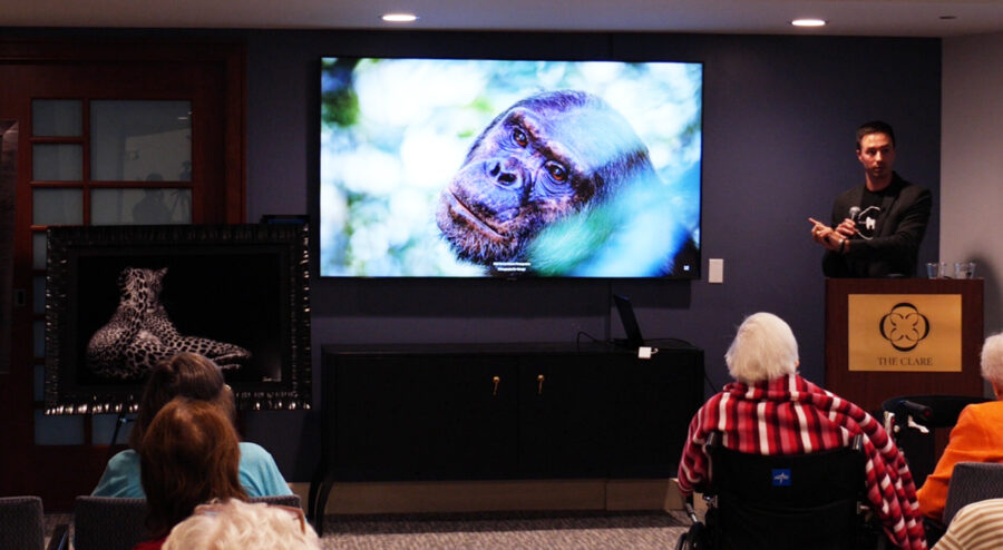 Photographer Derek Nielsen public speaking to a large audience monetizing his personal brand